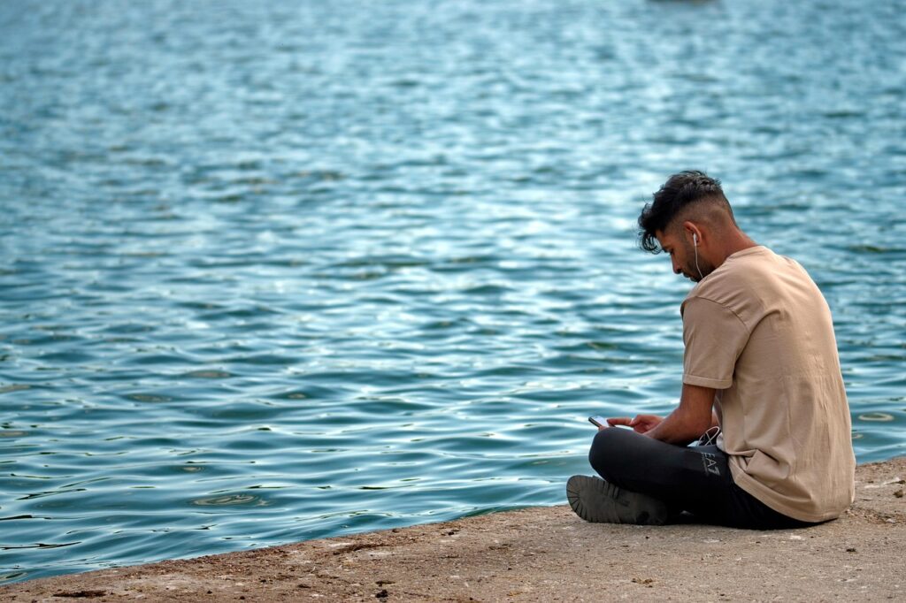boy, the person, young, placed, the shores of the lake, listening to the, the music, nature, the headphones your ears, phone, relaxation, the water, the nature, spring, park, android